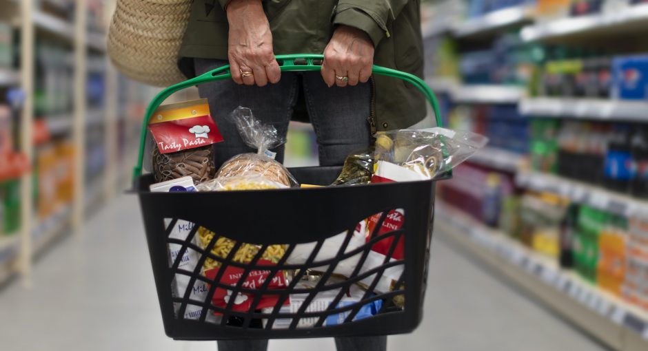 person holding a bucket with products